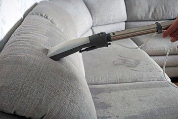 Washing vacuum cleaner cleans the sofa